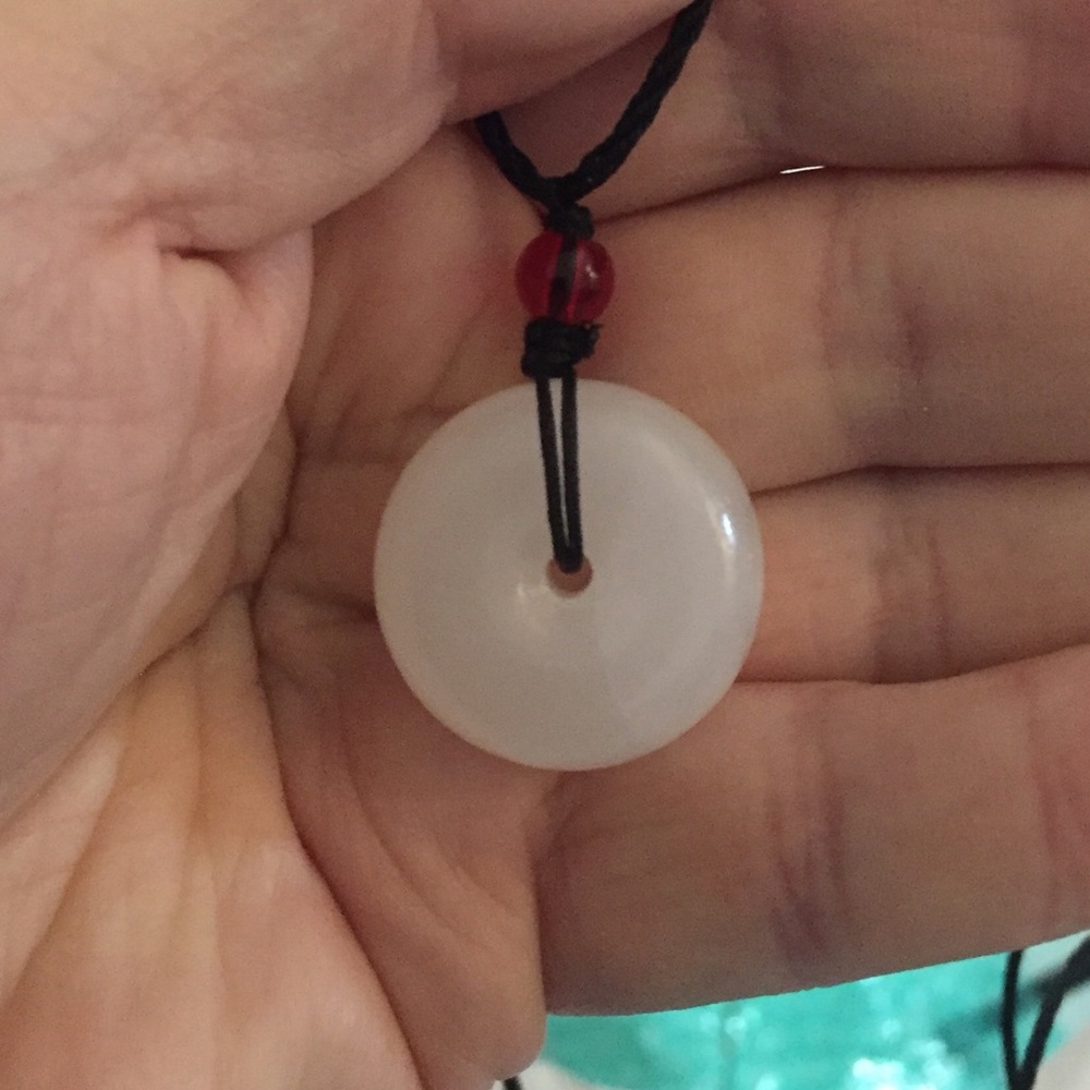Bi Disk with adjustable neck cord. Good luck charm